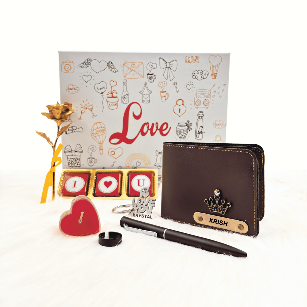 A box showcasing customized leather wallet, I Love You chocolate & keychain, pen, along with a gold rose and heart shaped sceneted candle higlighting their features. Perfect for valentines gifting.