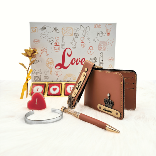 A customized tan leather wallet, tan keychain, gold flaked pen, metal kada, scented candle with a gold plated rose, enclosed in a white box, perfect for valentines gifting.