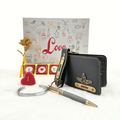 A customized grey leather wallet, grey keychain, gold flaked pen, metal kada, scented candle with a gold plated rose, enclosed in a white box, perfect for valentines gifting.