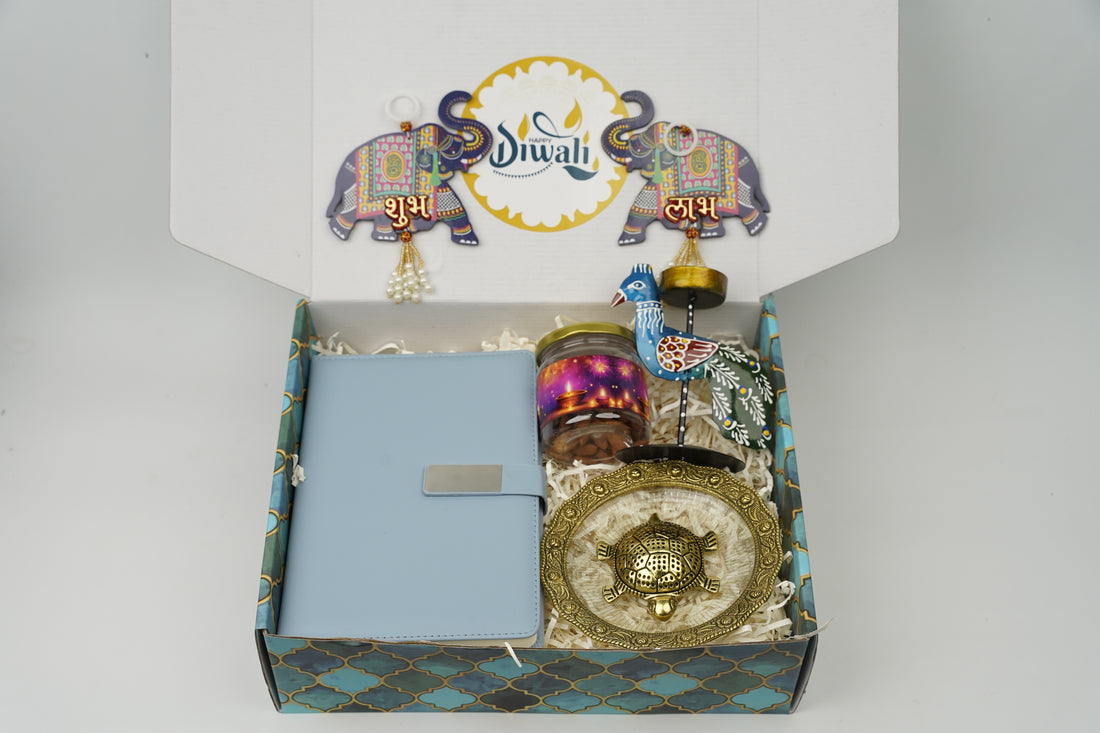 "Personalized Diwali Gift Hamper 4.0-BLUE✨ Metal Flip Diary, Kacchua with Glass Plate Lucky Charm, Peacock Tea Light Candle, Shubh Labh Latkan, Almond Jar & Designer Box | Festive Gift Hamper 🎁