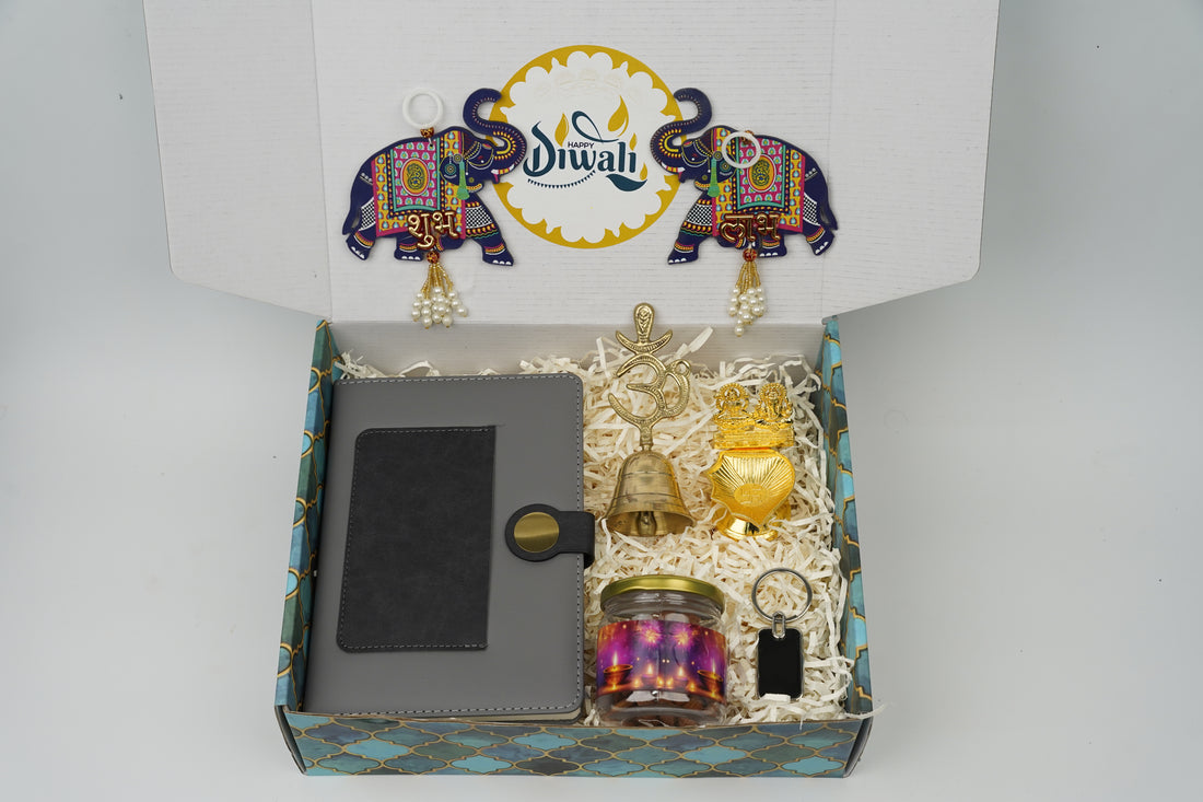 "Personalized Diwali Gift Hamper 2.0-GREY “Dual Shade Diary, Metal Keychain, Om Brass Bell, Laxmi Ganesh Diya, Almond Jar & Shubh Labh Latkan – Festive Gift Box”
