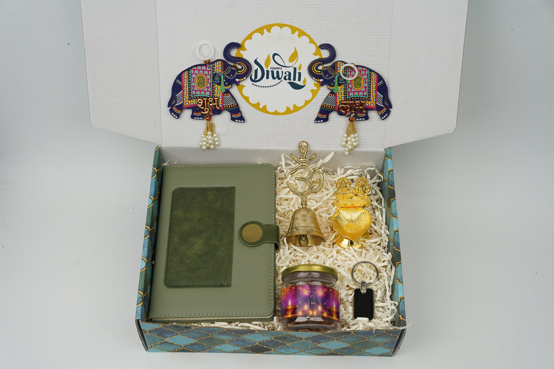 "Personalized Diwali Gift Hamper 2.0-GREEN “Dual Shade Diary, Metal Keychain, Om Brass Bell, Laxmi Ganesh Diya, Almond Jar & Shubh Labh Latkan – Festive Gift Box”