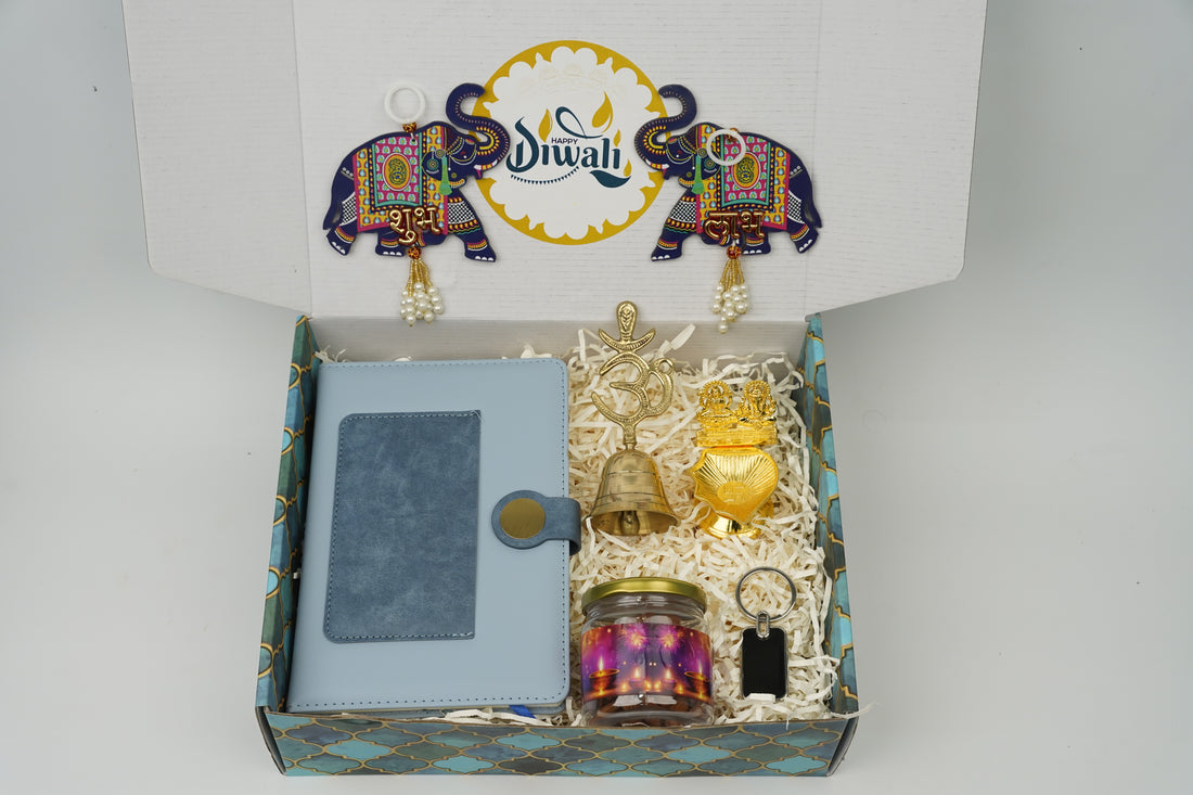 "Personalized Diwali Gift Hamper 2.0-BLUE“Dual Shade Diary, Metal Keychain, Om Brass Bell, Laxmi Ganesh Diya, Almond Jar & Shubh Labh Latkan – Festive Gift Box”