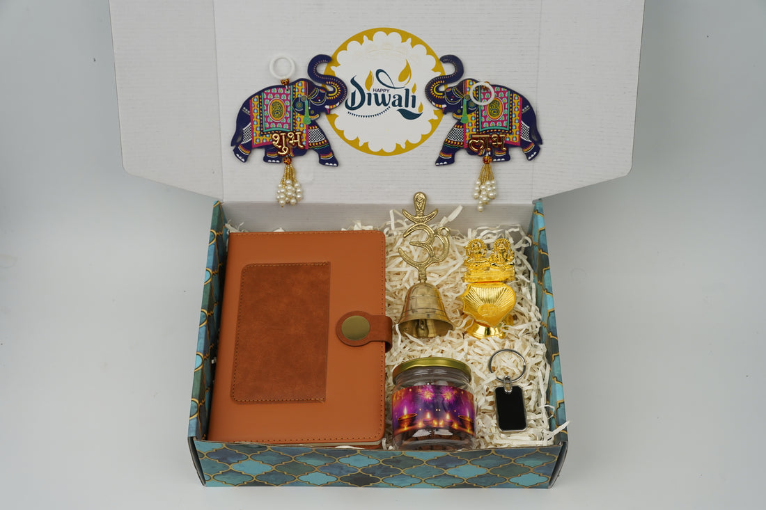 "Personalized Diwali Gift Hamper 2.0-BROWN “Dual Shade Diary, Metal Keychain, Om Brass Bell, Laxmi Ganesh Diya, Almond Jar & Shubh Labh Latkan – Festive Gift Box”