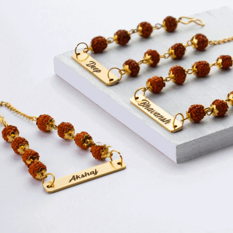 (Pack of 2 )Rudraksha Rakhi Bracelet Customised with Name - YOUR GIFT STUDIO.Frontview of our stylish,classy and affordable rakhis Gift your brother a personalised rakhi with a polaroid photo.