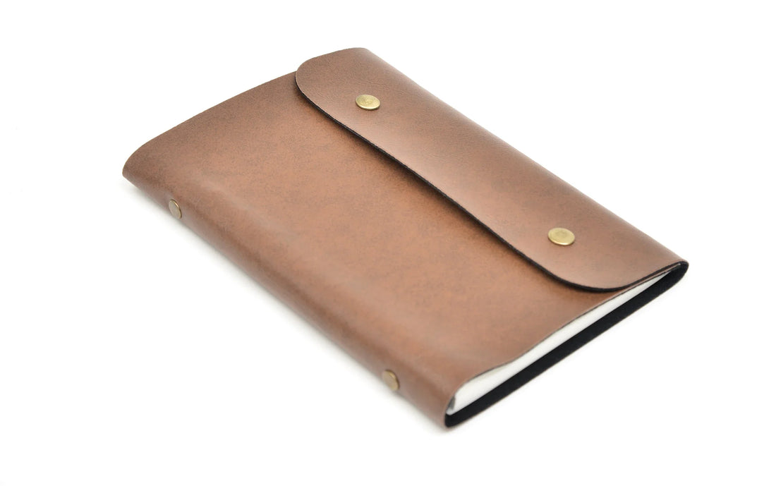 Make a statement with our stylish and practical customized leather buttoned diary. With multiple compartments and a sleek design, it's the perfect way to stay organized.