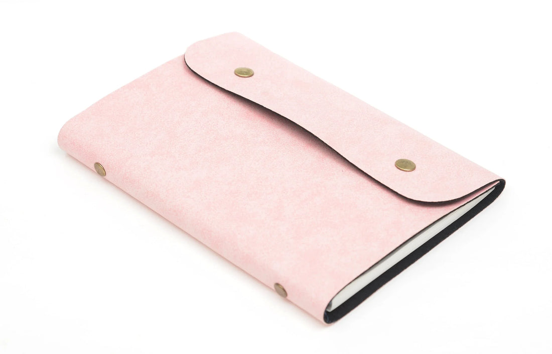 Make a statement with our elegant and practical customized leather buttoned diary. Perfect for any occasion, it's the perfect way to stay organized and stylish.