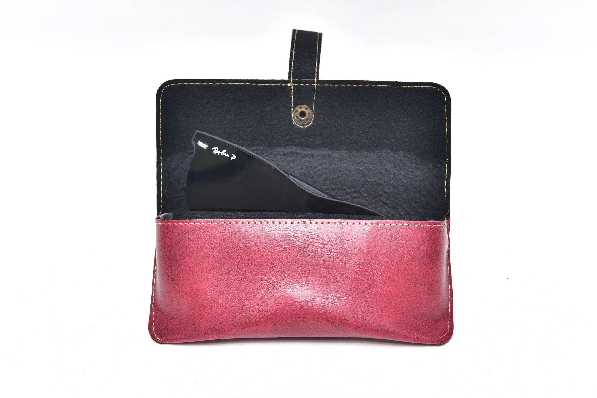 Inside or open view of maroon sunglasses case