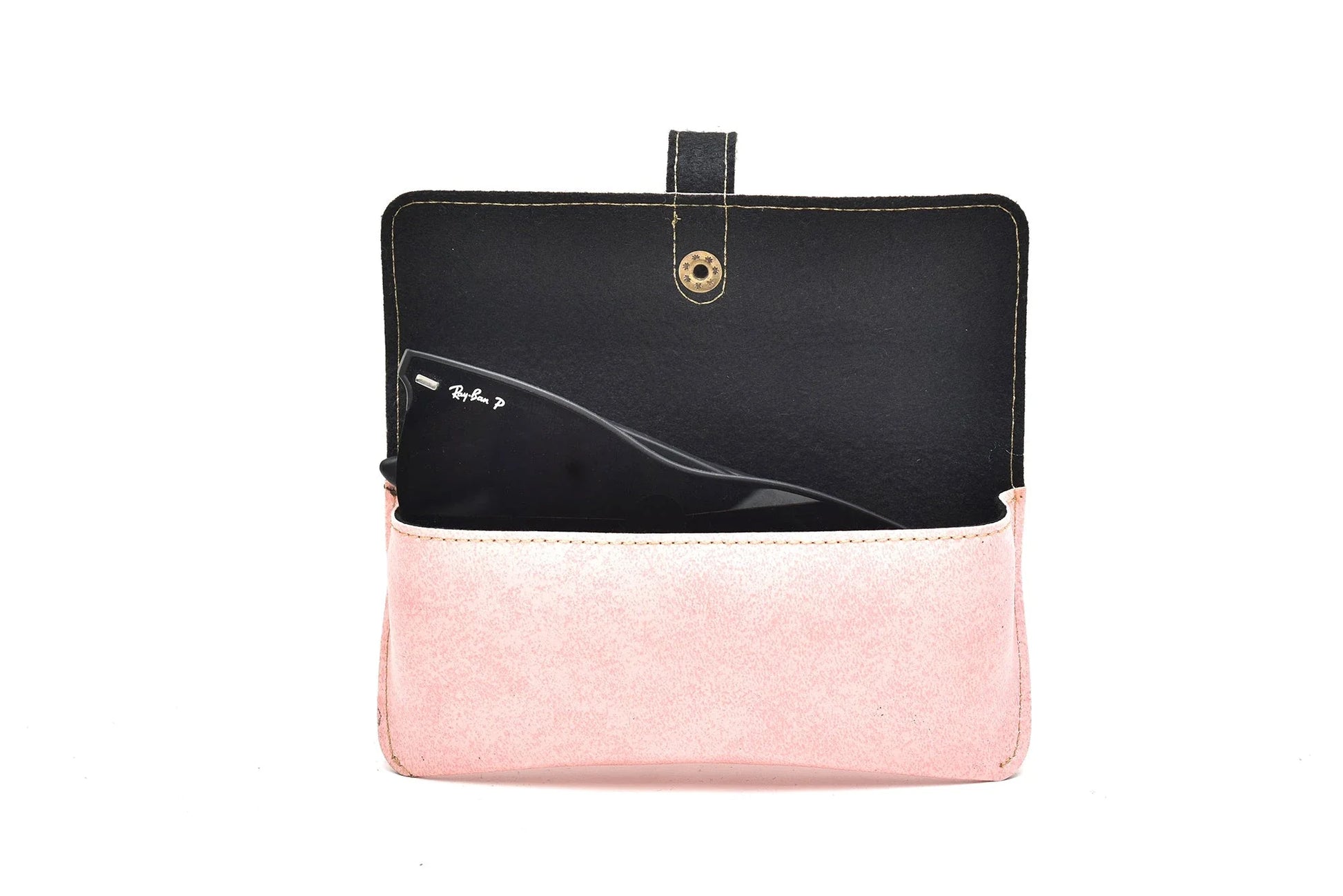 Inside or open view of light pink sunglasses case
