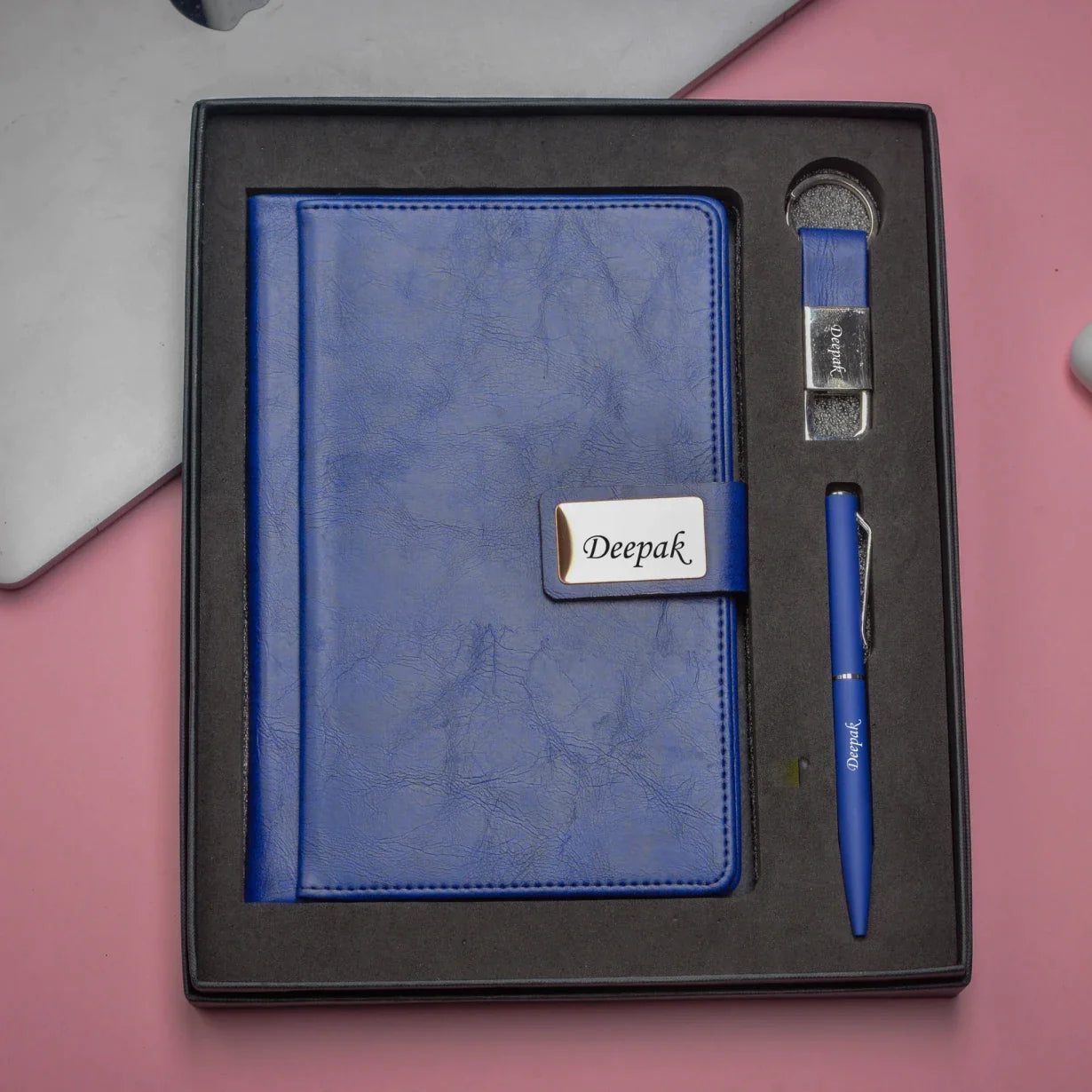 "Stay organized and on-the-go with our ultimate corporate combo. Our high-quality diary, sleek pen, and practical keychain will help you tackle any task, no matter where life takes you."