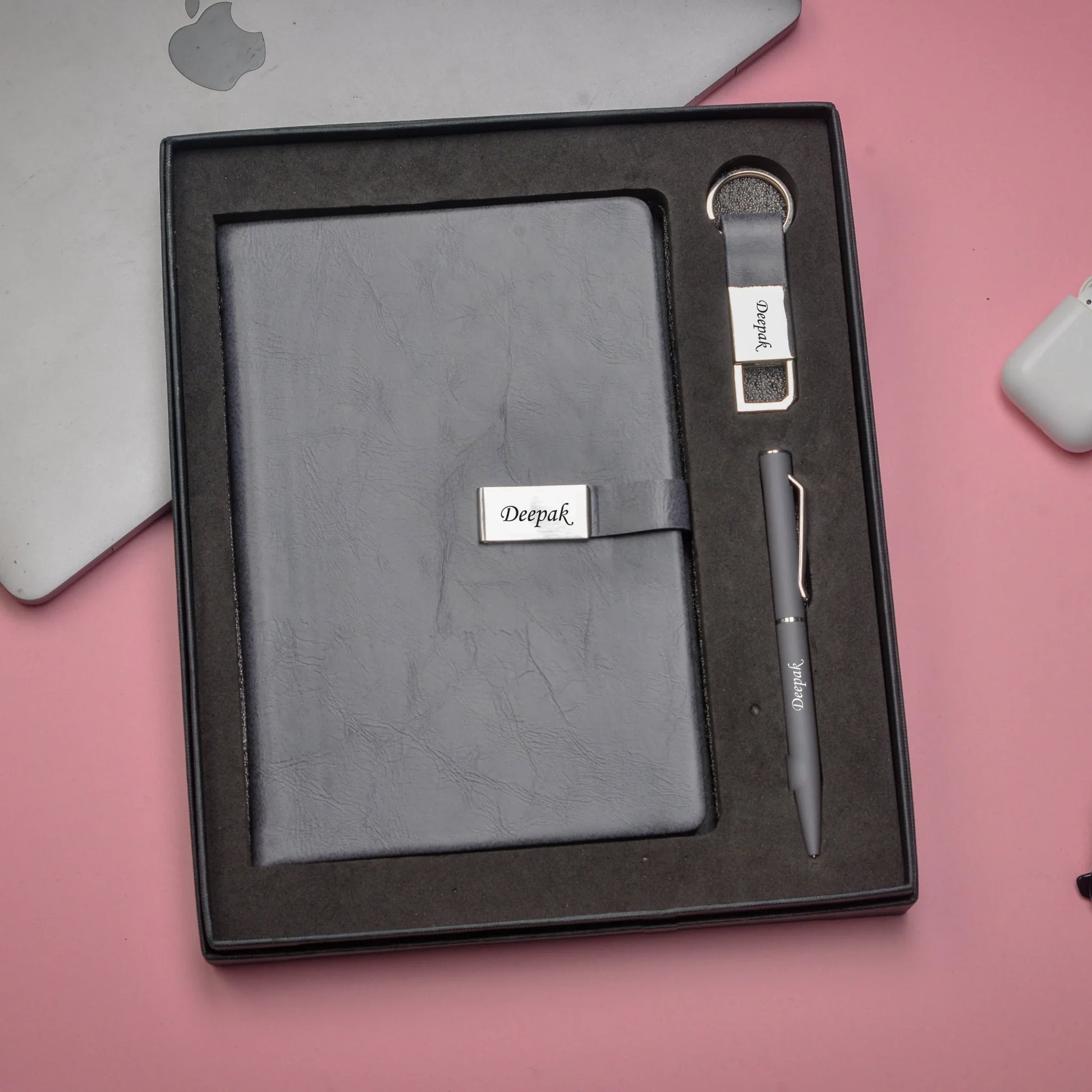 "Take your productivity to the next level with our advanced corporate set. Our innovative diary, high-tech pen, and cutting-edge keychain will keep you ahead of the curve."