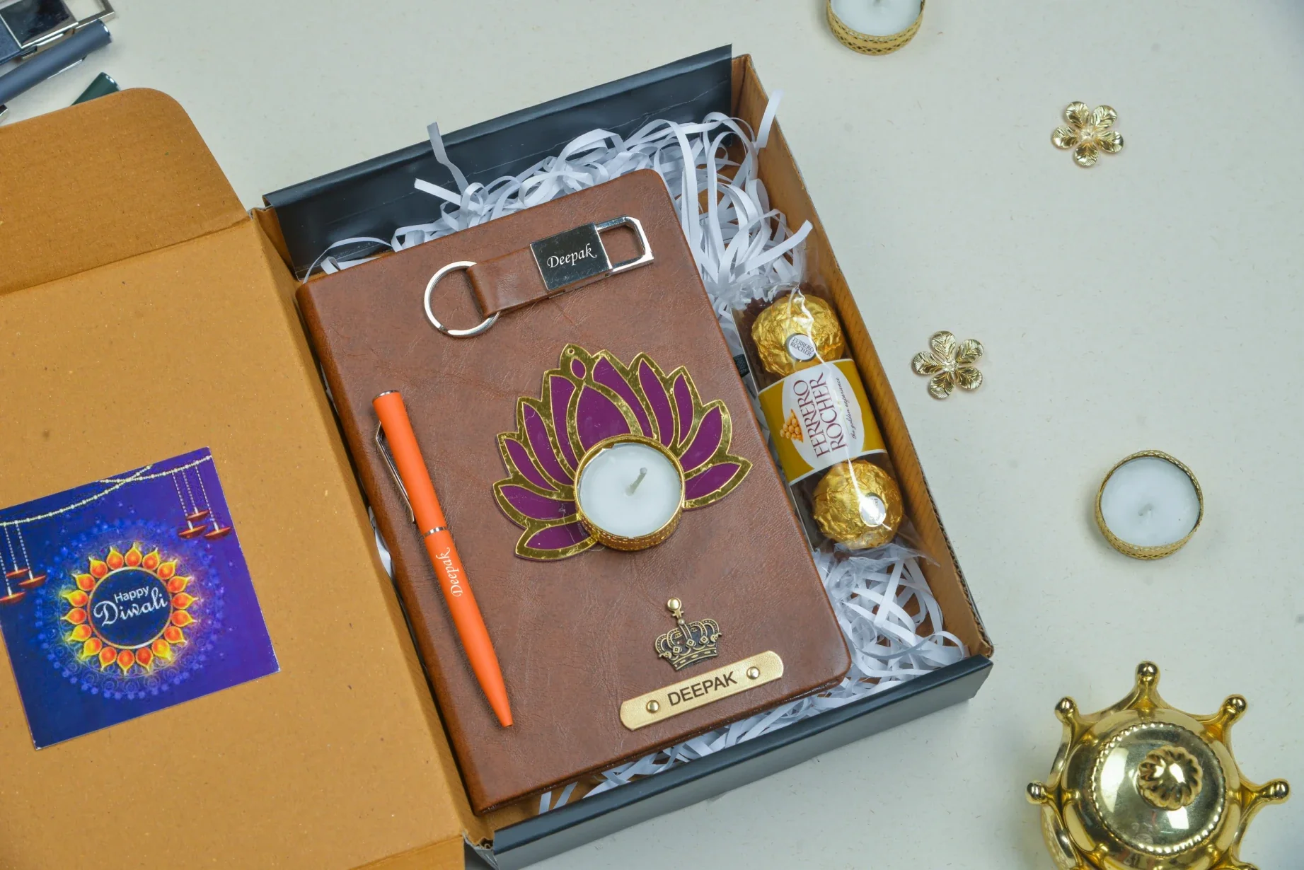 Make your Diwali celebration truly special with our customizable Diwali combo. This set includes a premium quality diary, a stylish keychain, a traditional diya, delicious chocolates, and a high-quality pen, all designed to bring a touch of traditional elegance and practicality to your Diwali celebrations.