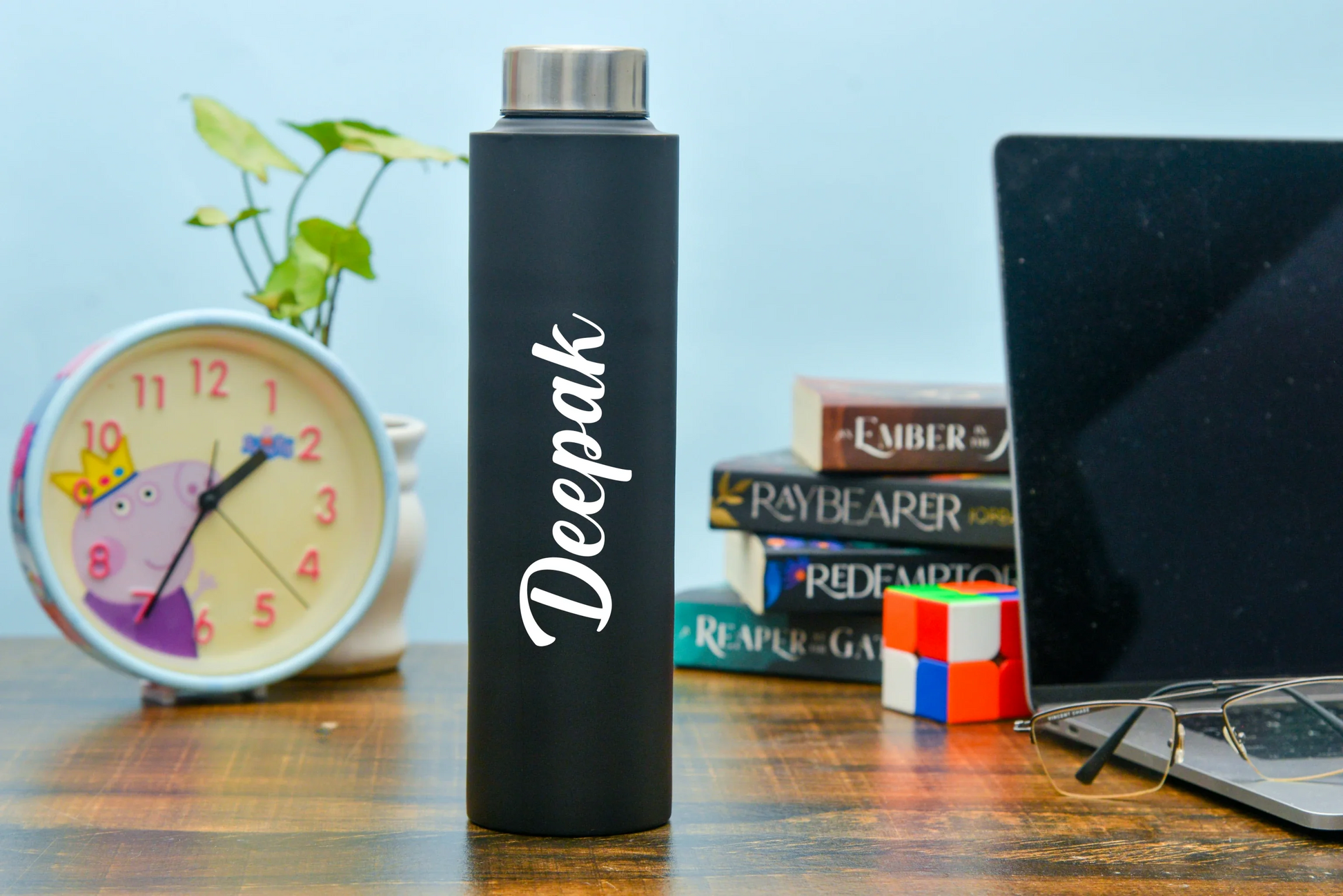 Keep your drinks hot or cold for hours with our double-walled stainless steel bottle. Personalize it with your name or initials for a one-of-a-kind accessory.
