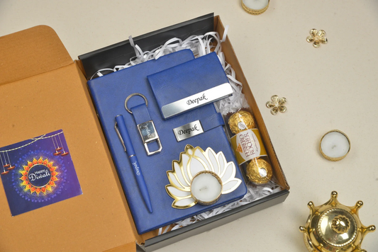 Celebrate the festive season in style with our Diwali Combo! This combo includes a sleek diary, a stylish keychain, a beautiful diya, delicious chocolates and a sophisticated pen, as well as a practical card holder, making it the perfect gift for friends and family.