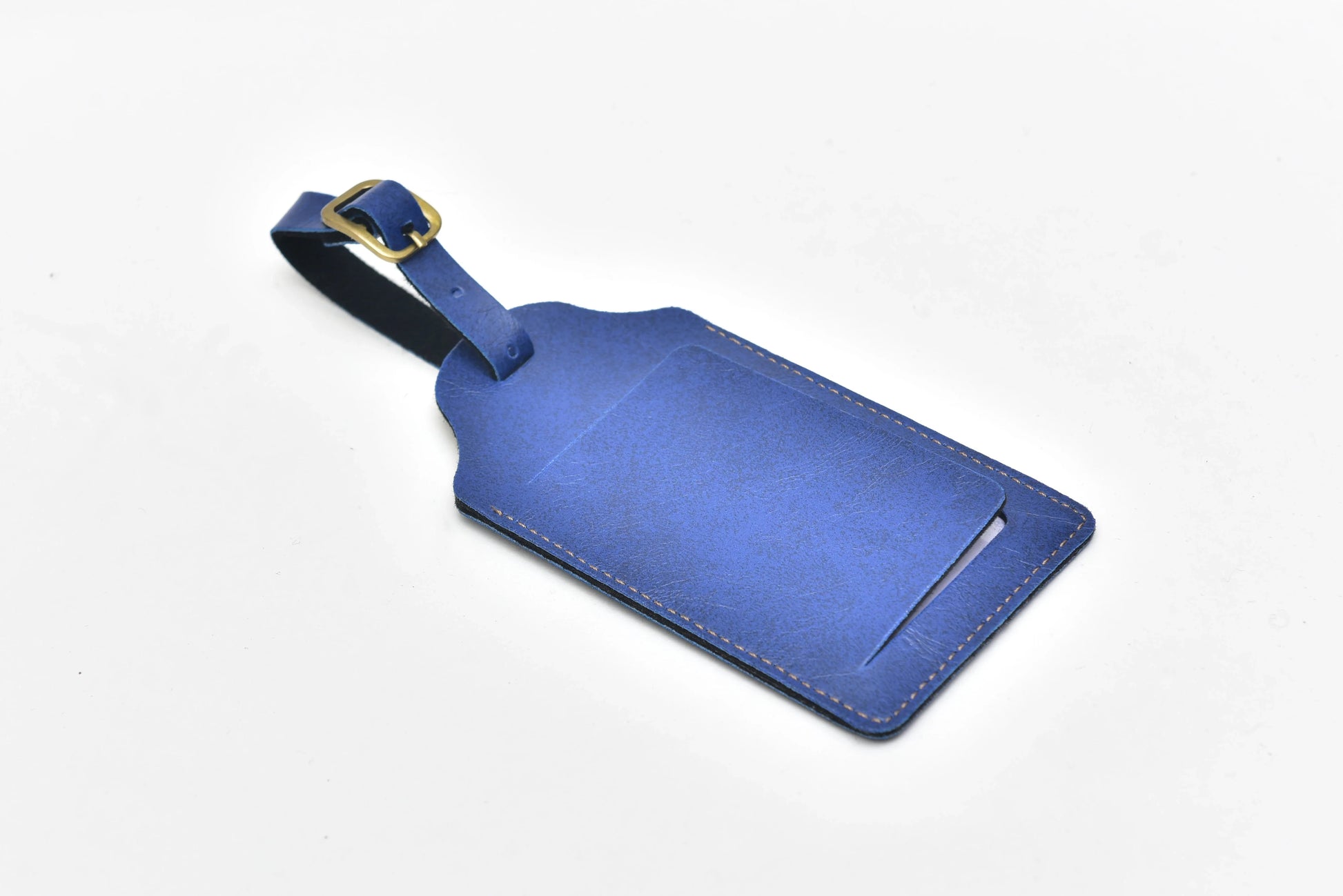 Travel smart with our customized luggage tags. These tags are made from durable materials, and can be personalized with your choice of design, logo, or photo, making them the perfect choice for anyone looking for a functional and stylish accessory. Back view of royal blue luggage tag