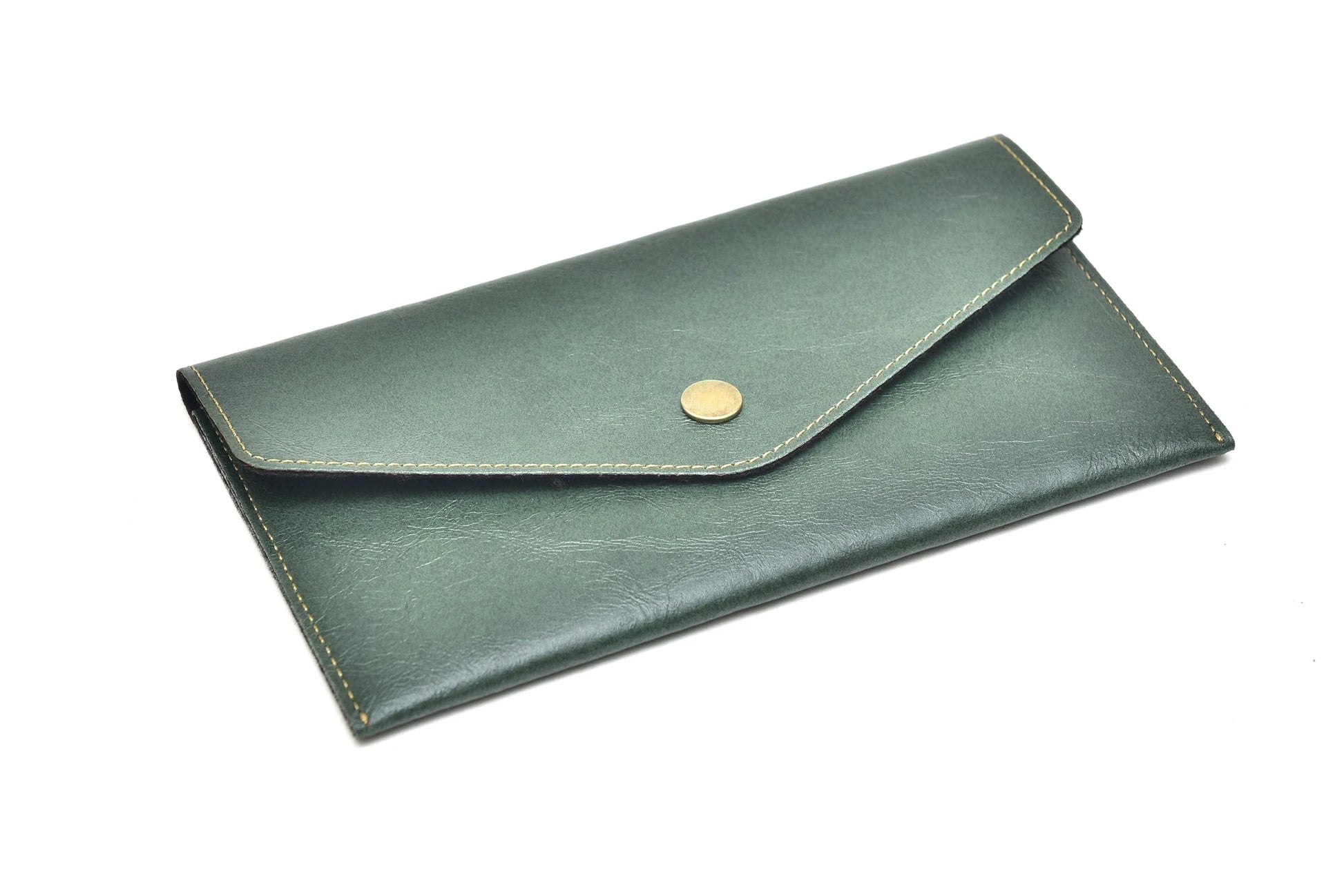 Carry your essentials in style with this chic and compact personalized leather clutch. With a variety of customization options, make it your own and stand out from the crowd.