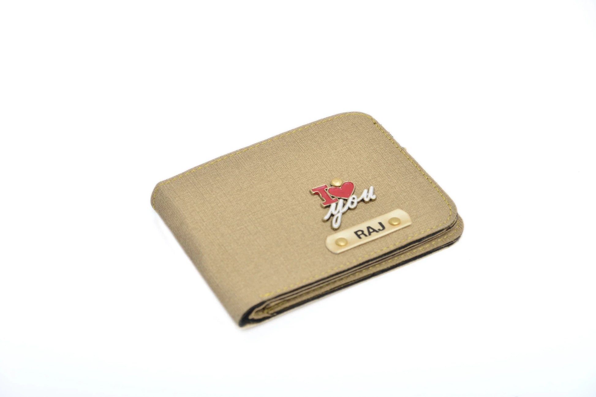 Personalized Men's Wallet - Beige.Classy wallet made with the top-notch quality vegan leather is the perfect touch to any office/formal attire. The option to personalize it with your name and lucky charm makes it that much more special and close to heart. This is the best corporate gift! Always be trending and in fashion with our customized wallets. The Mens Wallet material is vegan/synthetic/faux/PU leather