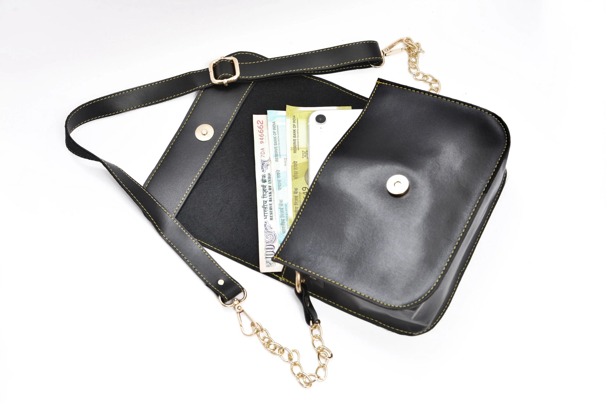Inside or open view of black chained sling bag