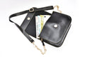 Inside or open view of black chained sling bag