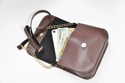 Inside or open view of brown chained sling bag