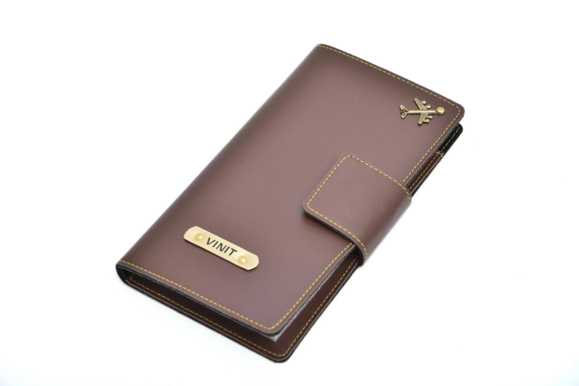 personalized-travel-wallet-brown-customized-best-gift-for-boyfriend-girlfriend. Classy wallet made with the top-notch quality vegan leather is the perfect touch to any office/formal attire. The option to personalize it with your name and lucky charm makes it that much more special and close to heart. This is the best corporate gift! Always be trending and in fashion with our customized wallets. The travel Wallet material is vegan/synthetic/faux/PU leather