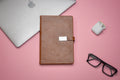 Our diary is the perfect accessory for anyone who loves to write and reflect on their day. With its leather cover and smooth, unlined pages, this journal is the perfect place to capture your thoughts, ideas, and creative inspiration.